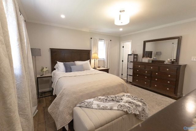 bedroom featuring ornamental molding, wood finished floors, and recessed lighting