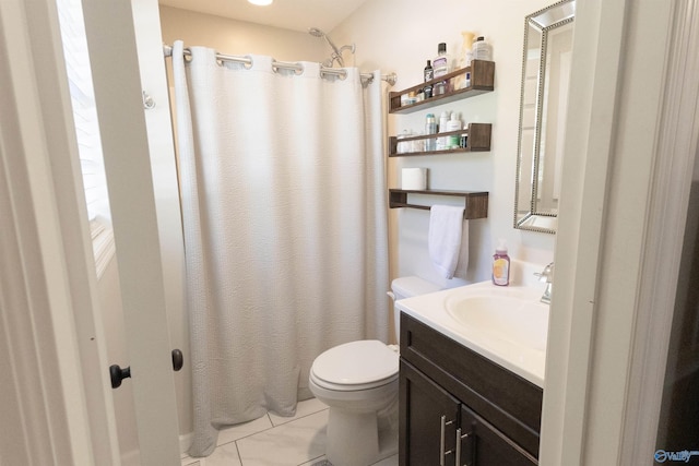bathroom featuring vanity, curtained shower, and toilet
