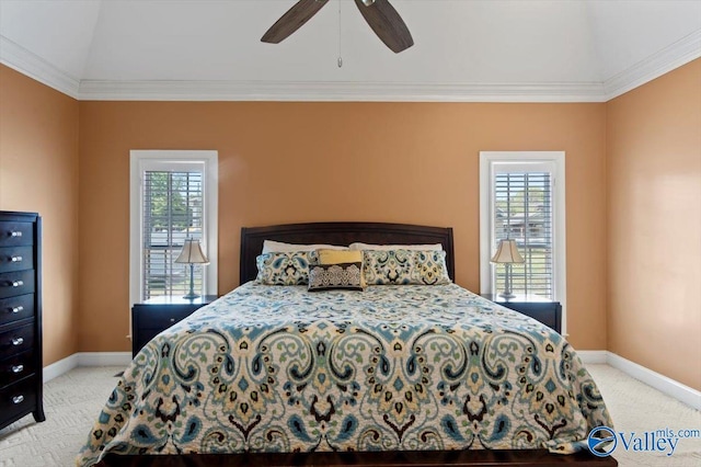 bedroom with baseboards, crown molding, light colored carpet, and multiple windows