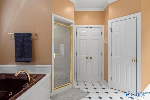 full bathroom with a shower stall, tile patterned floors, a closet, crown molding, and a garden tub