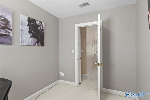 carpeted office featuring baseboards and visible vents