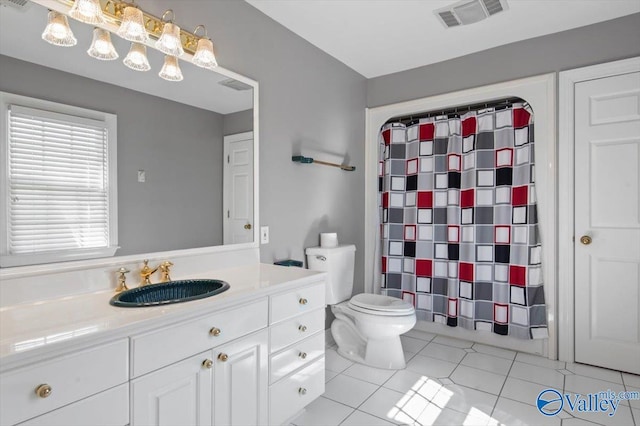 full bathroom featuring visible vents, tile patterned flooring, vanity, and toilet