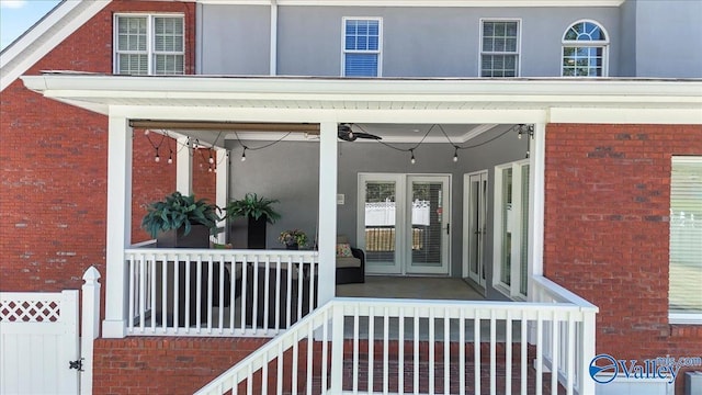 property entrance featuring brick siding and stucco siding