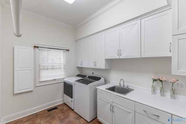 laundry room with cabinets, independent washer and dryer, ornamental molding, and sink