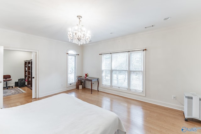 bedroom with light wood-type flooring, radiator, ornamental molding, and a notable chandelier