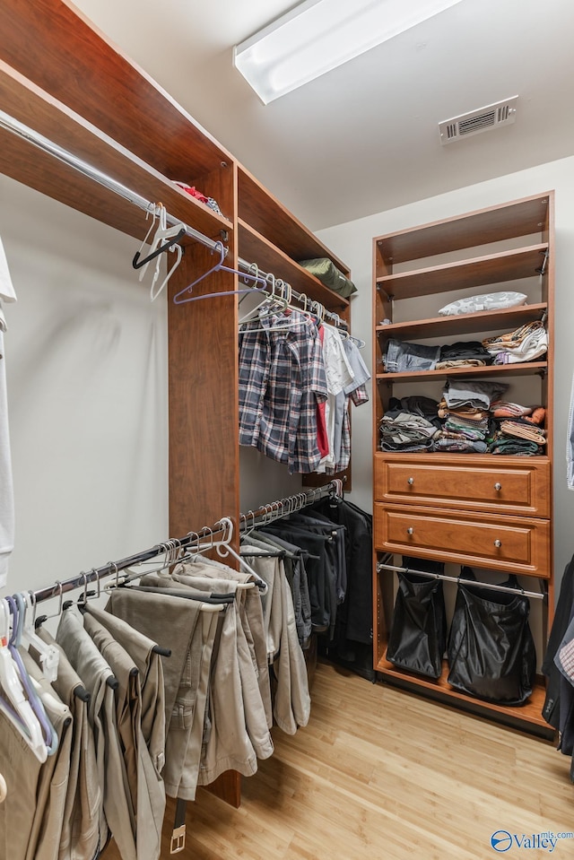 walk in closet featuring light wood-type flooring