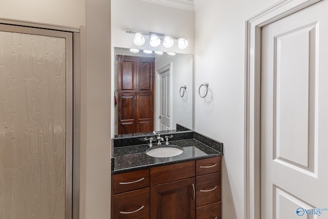 bathroom with vanity and ornamental molding