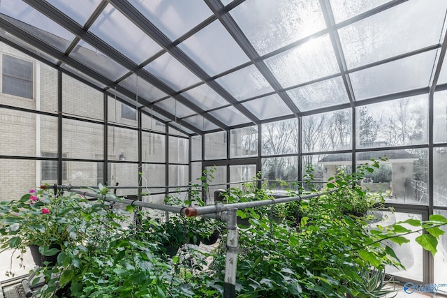 unfurnished sunroom with vaulted ceiling