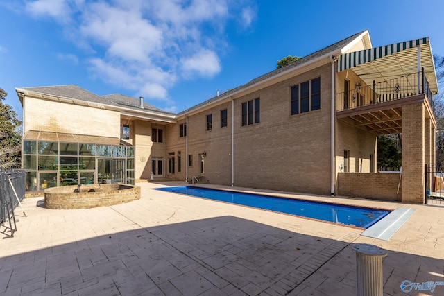 view of swimming pool featuring a patio