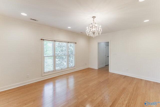 4521 Ivy Dale Rd, Decatur, AL 35603 - spare room with a chandelier, light wood-style floors, crown molding, baseboards, and recessed lighting