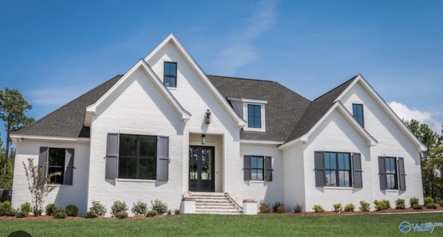 view of front of home with a front yard