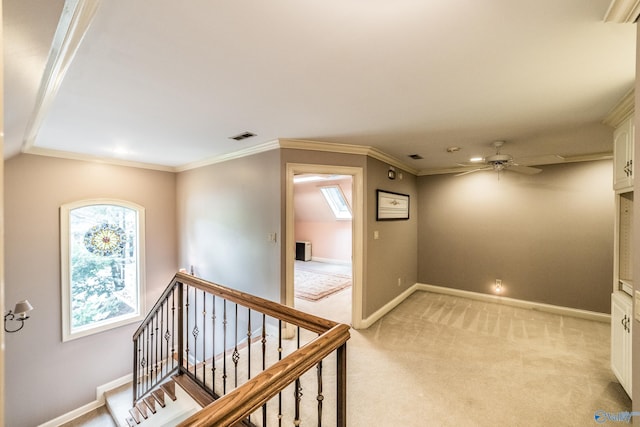 hallway featuring light colored carpet and ornamental molding