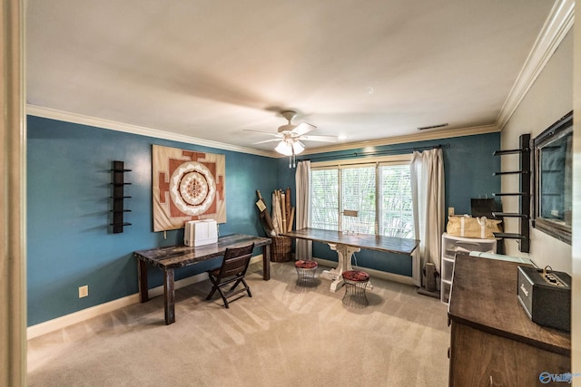 carpeted home office with ceiling fan and ornamental molding