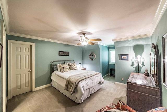 carpeted bedroom with crown molding and ceiling fan