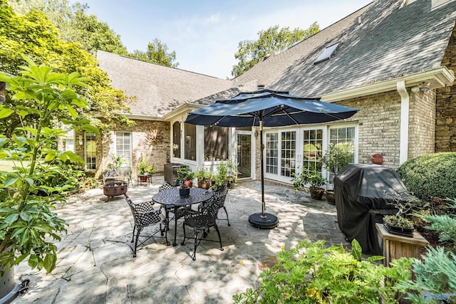 view of patio / terrace with area for grilling and a fire pit