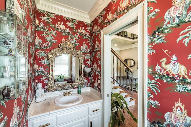 bathroom with vanity and crown molding