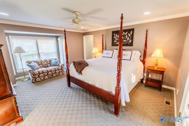 carpeted bedroom featuring ceiling fan and crown molding