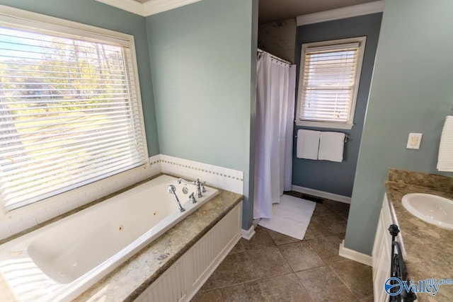 bathroom featuring tile patterned floors, crown molding, vanity, and a relaxing tiled tub