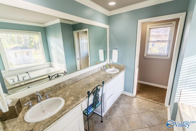 bathroom with tile patterned floors, a bathing tub, crown molding, and vanity