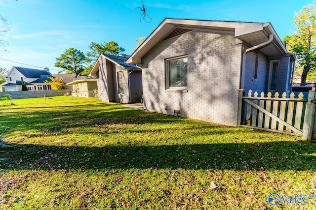 view of home's exterior featuring a lawn