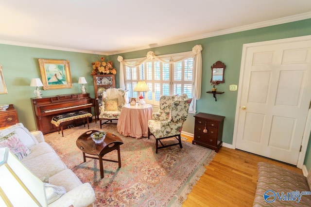 living room featuring hardwood / wood-style floors and ornamental molding