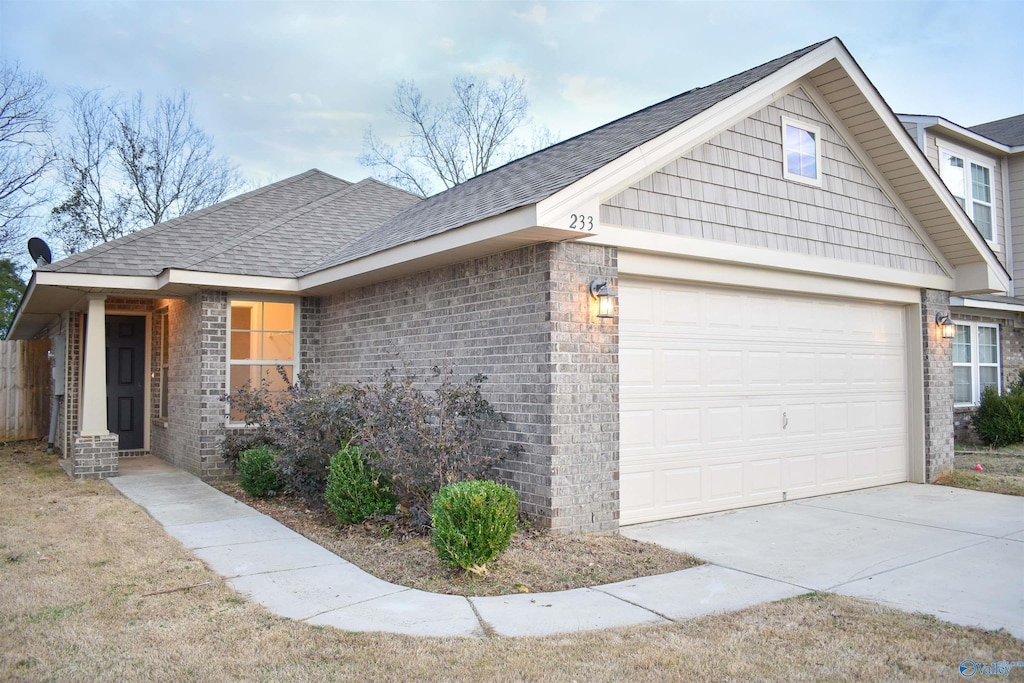 ranch-style home featuring a garage