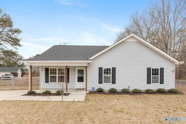 ranch-style house with a porch and a front lawn