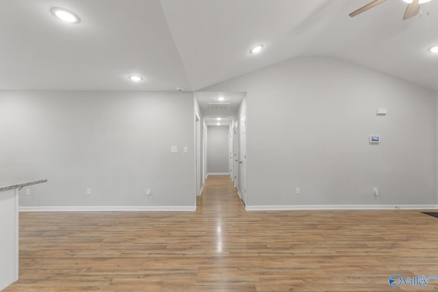 interior space with ceiling fan, light hardwood / wood-style flooring, and vaulted ceiling