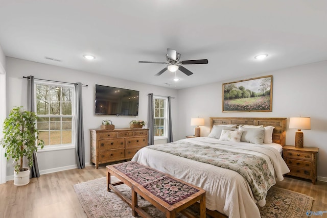 bedroom with ceiling fan and hardwood / wood-style floors