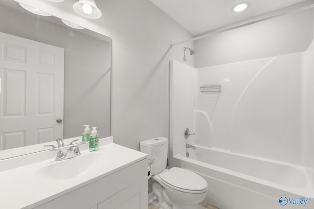 full bathroom featuring vanity,  shower combination, and toilet