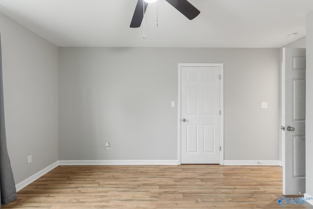 unfurnished room with ceiling fan and light hardwood / wood-style flooring