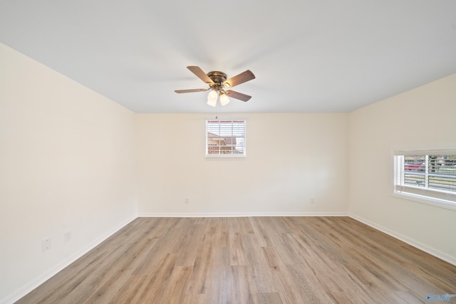 unfurnished room featuring light wood finished floors, ceiling fan, and baseboards