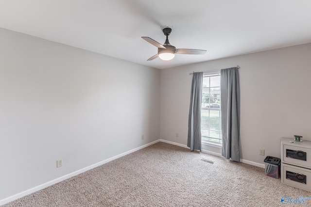 empty room featuring ceiling fan and carpet floors