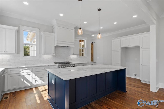 kitchen with dark wood-style floors, backsplash, and white cabinets