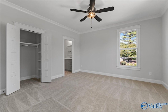 unfurnished bedroom featuring baseboards, ornamental molding, and light colored carpet