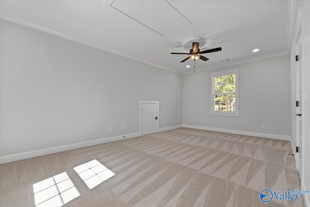 unfurnished room with recessed lighting, light colored carpet, crown molding, and baseboards