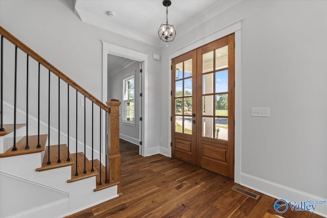 entrance foyer with french doors, visible vents, stairway, wood finished floors, and baseboards