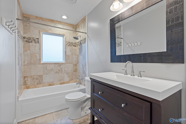 full bathroom with tile patterned floors, tiled shower / bath combo, toilet, and vanity