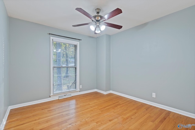 empty room featuring ceiling fan and light hardwood / wood-style flooring