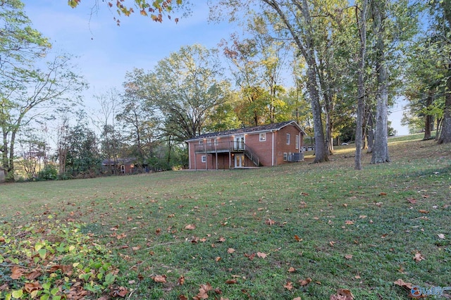 view of yard with a wooden deck