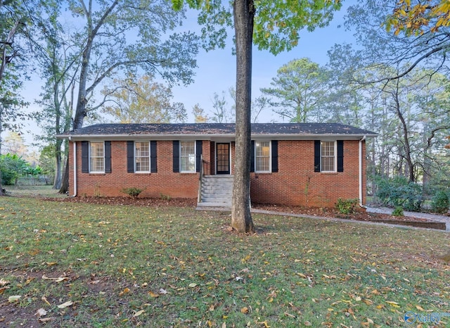 ranch-style home with a front lawn