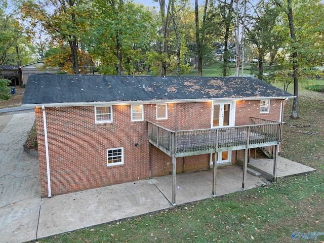 rear view of property with french doors and a deck