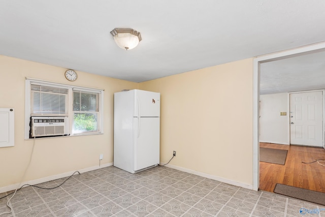 unfurnished room with light wood-type flooring