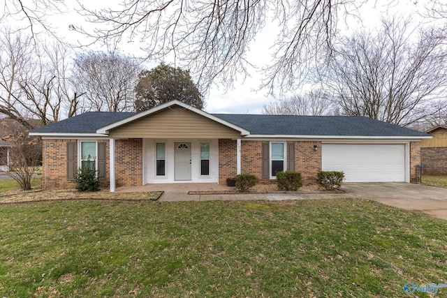 single story home with covered porch, a garage, and a front lawn