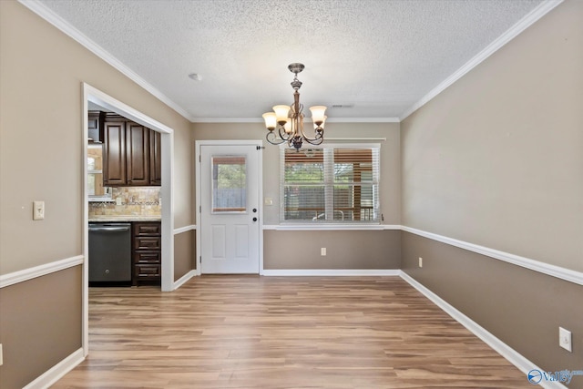 unfurnished dining area featuring baseboards, light wood-style flooring, and a chandelier