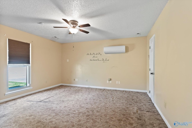 carpeted empty room featuring baseboards, a textured ceiling, an AC wall unit, and a ceiling fan