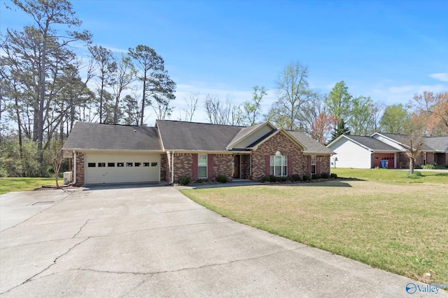 single story home with driveway, a front yard, an attached garage, and brick siding