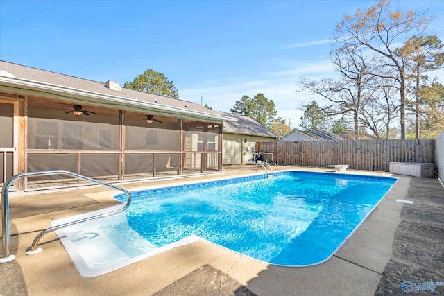 view of swimming pool featuring a patio, a fenced in pool, a fenced backyard, and ceiling fan