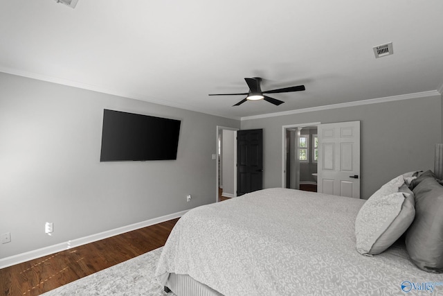 bedroom with dark hardwood / wood-style floors, ornamental molding, and ceiling fan