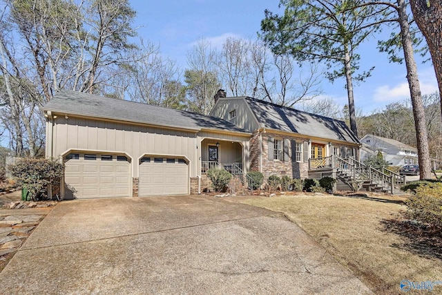 view of front of house featuring a garage, brick siding, driveway, roof with shingles, and a chimney